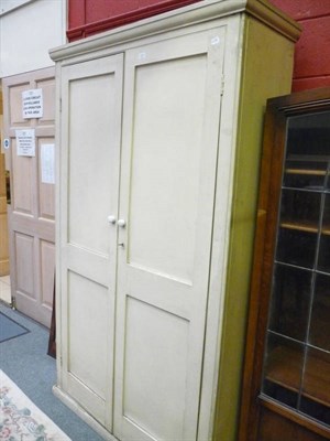 Lot 1237 - A large Victorian cream painted two door cupboard.