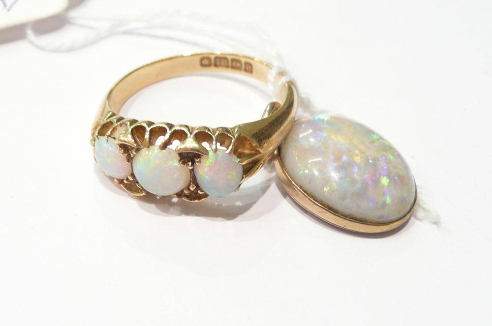 Lot 4 - A three stone opal ring, 18 carat gold shank and an opal pendant (2)
