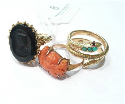 Lot 8 - A 9 carat gold onyx cameo ring, a carved coral ring and a coiled snake ring