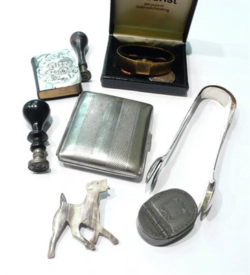 Lot 9 - A silver-faced miniature prayer book, two pairs of Georgian silver sugar tongs, a silver ingot...