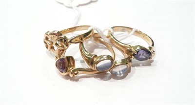 Lot 16 - An iolite ring and three dress rings