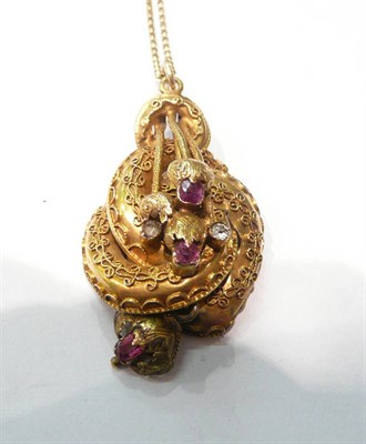 Lot 21 - A Victorian ruby set entwined pendant with later 9 carat gold fine chains and a 9 carat gold chain