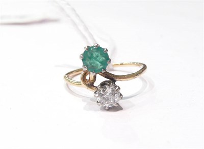 Lot 36 - An emerald and diamond two stone ring