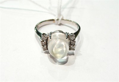 Lot 49 - A 14 carat moonstone and diamond ring