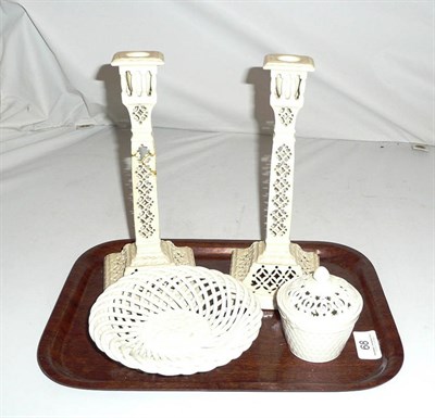 Lot 68 - A pair of Leeds pottery creamware candlesticks, a small Leeds pot and a continental dish