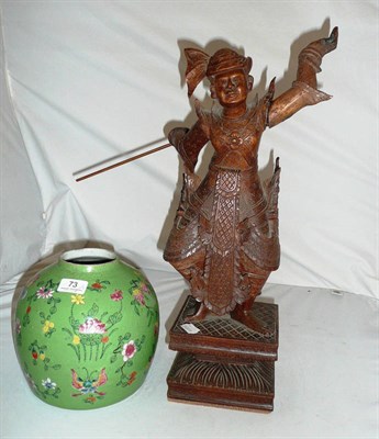 Lot 73 - A Thai wood figure and a green vase