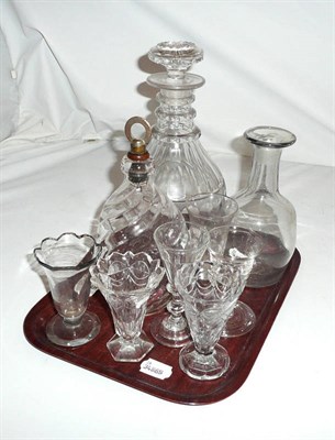 Lot 75 - A 19th century triple ring and slice cut decanter; a dimpled and fluted brandy decanter with...