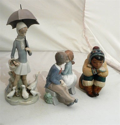 Lot 91 - A Lladro figure of a girl, a Lladro Eskimo and a Nao figure