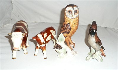 Lot 102 - Two Goebel bird ornaments and two Goebel cows