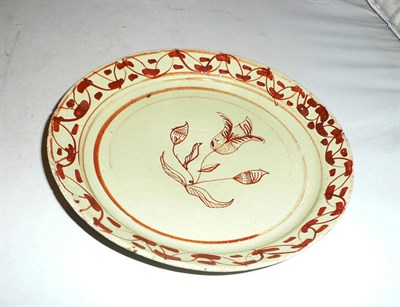 Lot 124 - A Continental tin-glaze 'pancake' plate