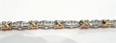 Lot 185 - A 9 carat two colour gold diamond set bracelet