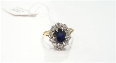 Lot 205 - A sapphire and diamond cluster ring