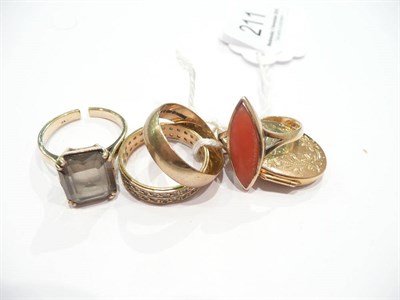 Lot 211 - A 9 carat gold band ring, a 9 carat gold smokey quartz ring (a.f.), two rings, and a locket