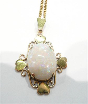 Lot 224 - An oval cabochon opal pendant on chain