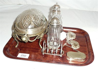 Lot 250 - Two silver-topped casters, silver toast rack and a plated snuff box, etc