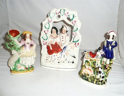 Lot 279 - Staffordshire arbour group and two Staffordshire figures