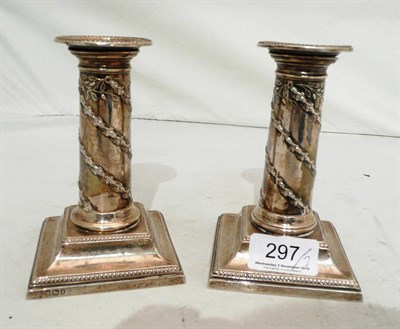 Lot 297 - A pair of silver candlesticks