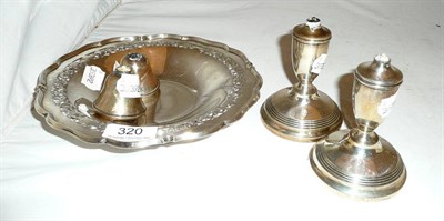 Lot 320 - A silver shallow pedestal comport, Sheffield 1932 and a pair of silver candlesticks (damaged)