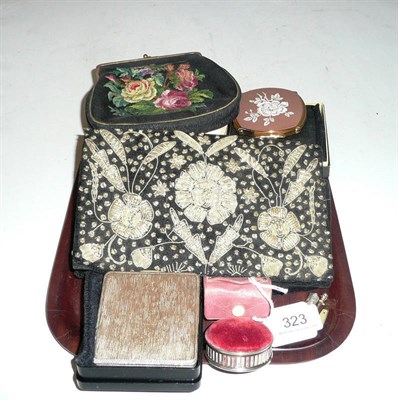 Lot 323 - A silver compact, a silver pin cushion, cigarette holders, a silver whistle, bags, napkin...