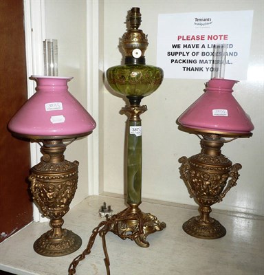 Lot 387 - Pair of gilt metal oil lamps and a gilt metal lamp (converted)