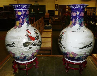 Lot 397 - A pair of large Oriental porcelain vases on stands