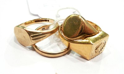 Lot 408 - Three 9 carat gold signet rings and a 9 carat gold band ring