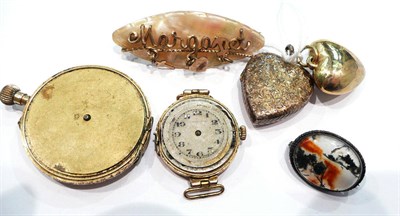 Lot 412 - A mother of pearl "Margaret" brooch, a 15k lady's watch, a locket and a moss agate brooch