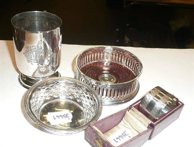 Lot 441 - Silver napkin ring, silver christening mug, silver coaster and a silver dish (4)