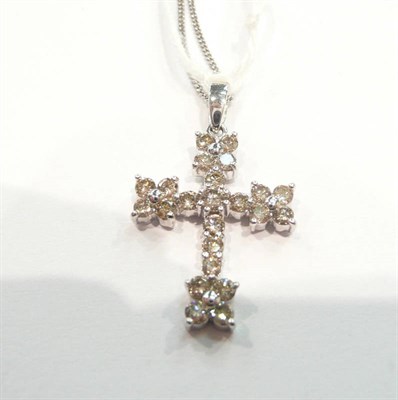 Lot 456 - Diamond set cross on a 9 carat white gold chain