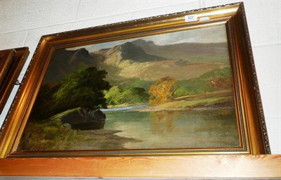 Lot 527 - Frank T Carter, oil painting 'Quiet lakeland river in a mountain landscape', signed (16" x 24")