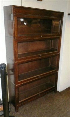 Lot 558 - Two oak four-tier bookcases