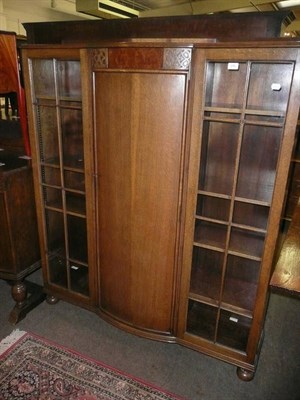 Lot 576 - 1940's oak sideboard and a matching bookcase