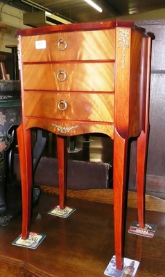 Lot 577 - A pair of reproduction mahogany and gilt mounted three drawer small chests