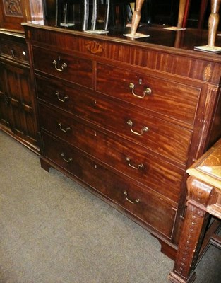 Lot 582 - A late George III mahogany five drawer chest with oval shell inlay