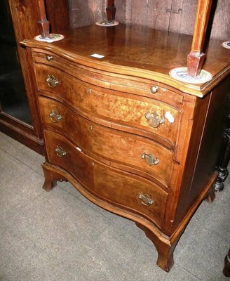 Lot 590 - Reproduction walnut serpentine fronted chest