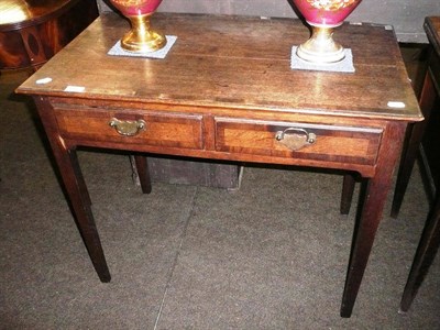 Lot 612 - An 18th century oak side table with two drawers