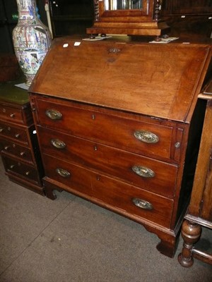 Lot 621 - George III mahogany bureau