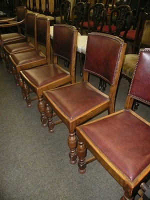 Lot 634 - Set of six oak dining chairs including one carver