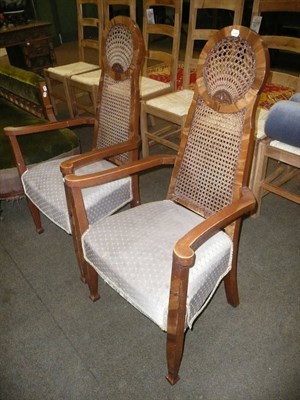 Lot 649 - A pair of 1930's walnut framed bergere chairs