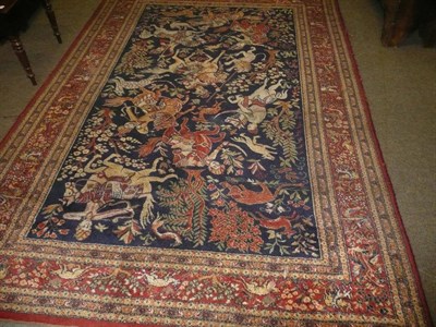 Lot 653 - Machine made Continental carpet depicting a Persian hunting scene