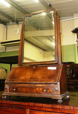 Lot 667 - A walnut dressing table mirror