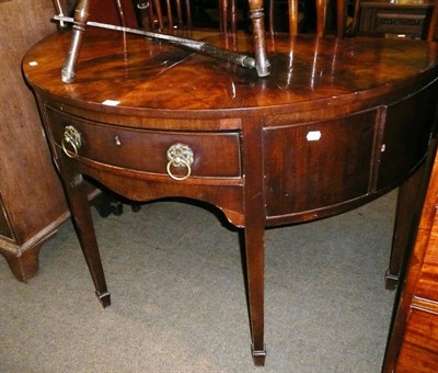 Lot 669 - George III mahogany D-section sideboard