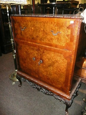 Lot 684 - Walnut cocktail cabinet