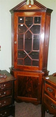 Lot 696 - A 19th century free standing corner cabinet with fluted and canted sides