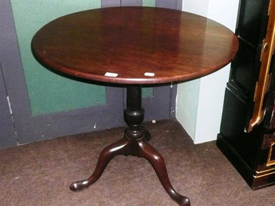 Lot 701 - A mahogany tripod table with bird cage top