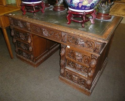 Lot 703 - Victorian carved oak desk