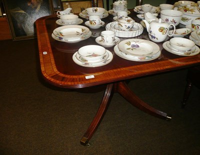 Lot 706 - A reproduction mahogany dining table with two leaves