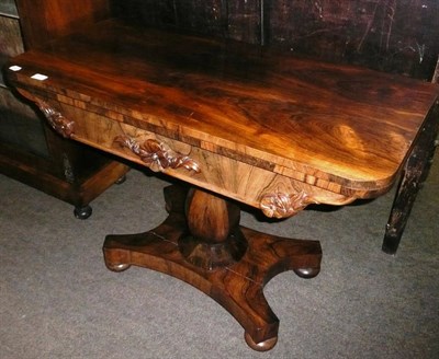 Lot 707 - A William IV rosewood fold over tea table