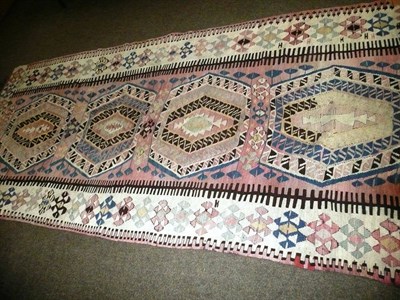 Lot 720 - Anatolian Kilim, 19th century, the polychrome field of stepped medallions