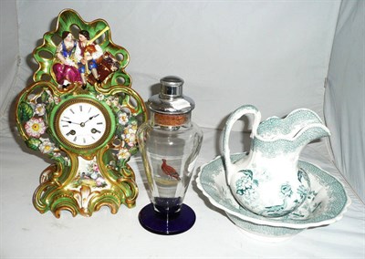 Lot 13 - Continental porcelain mantel clock, a wash jug and bowl and a cocktail shaker
